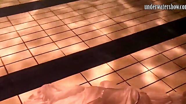 Honeys swim and get undressed underwater